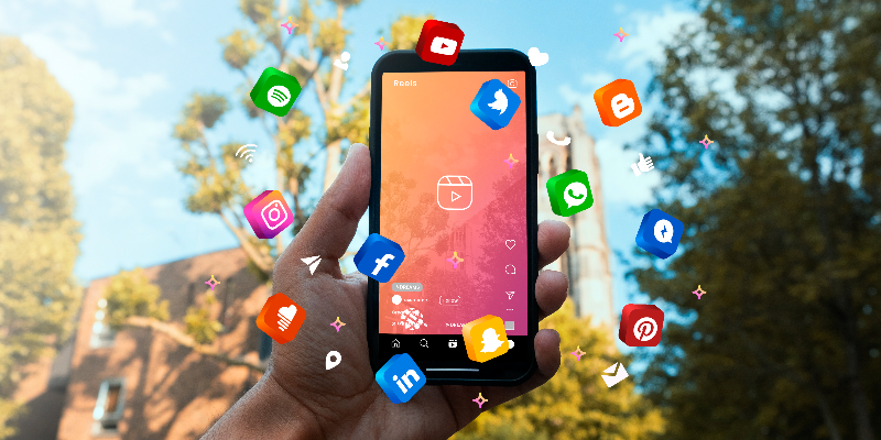 Hand holding smartphone for social media concept